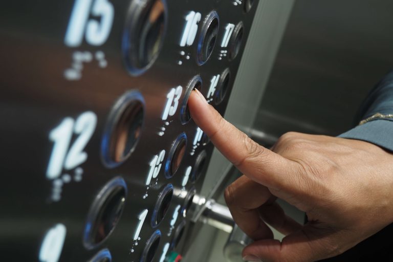close-up-of-a-hand-pressing-elevator-button-on-the-2026-01-09-10-25-46-utc